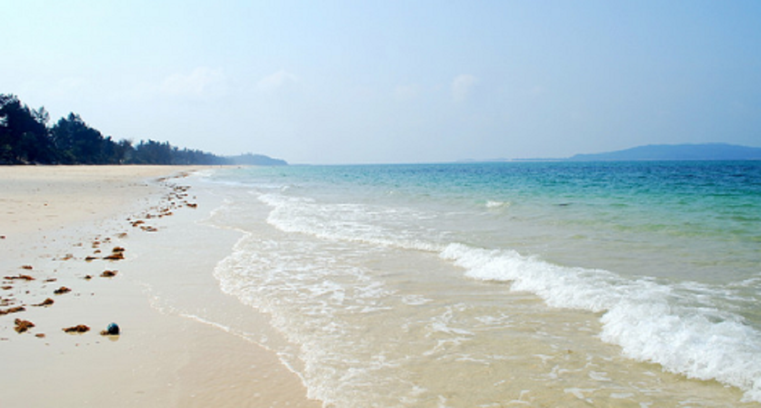 Quan Lan with the softly white sand beach and emerald oceanic water